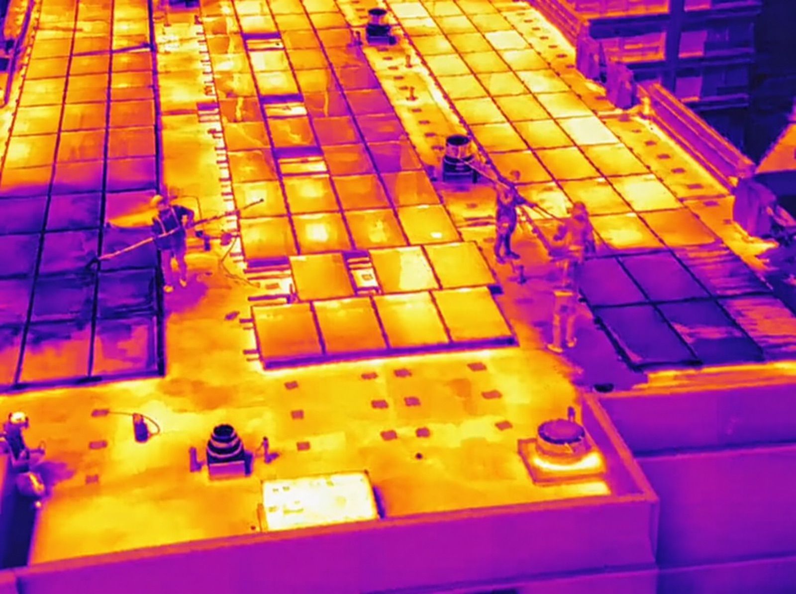 Thermal drone image with hot spots visible on a rooftop array