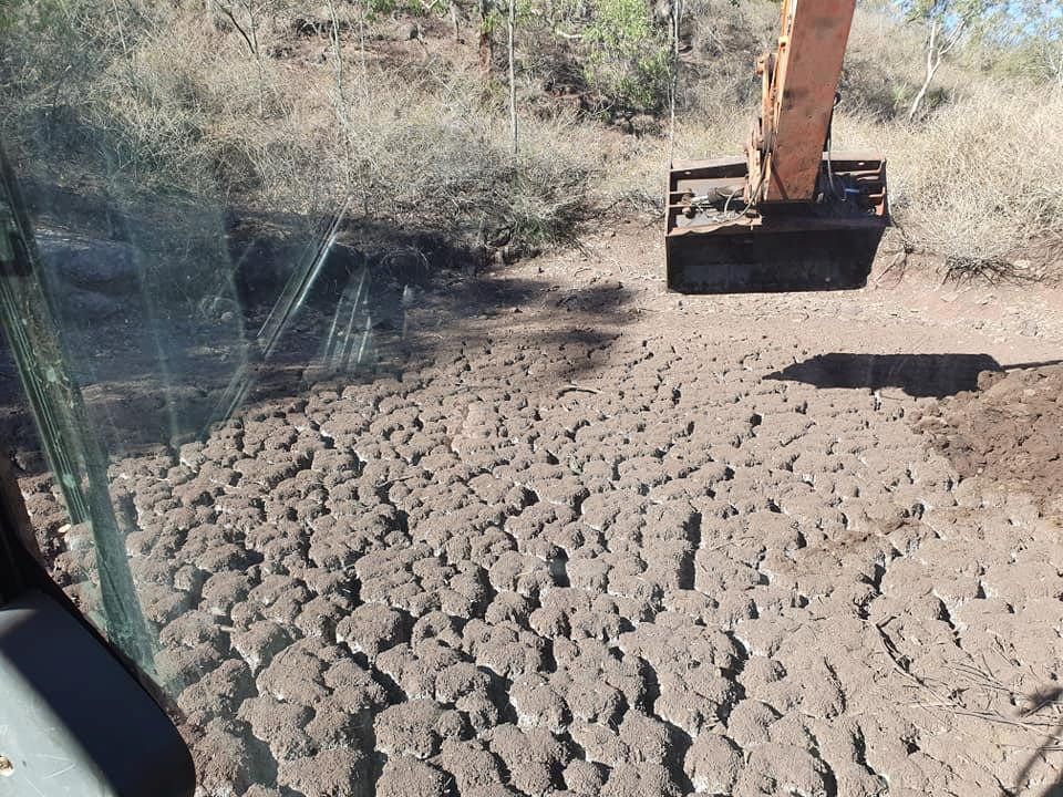 An Excavator is Digging a Hole in the Dirt — Oakleigh Earthmoving in Warwick, QLD