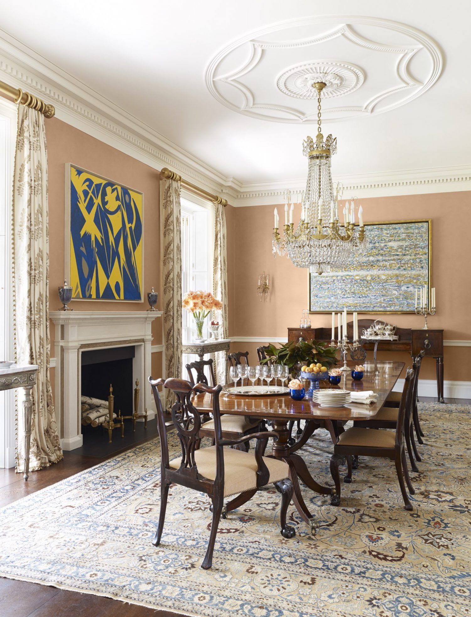 a dining room with a table and chairs and a chandelier
