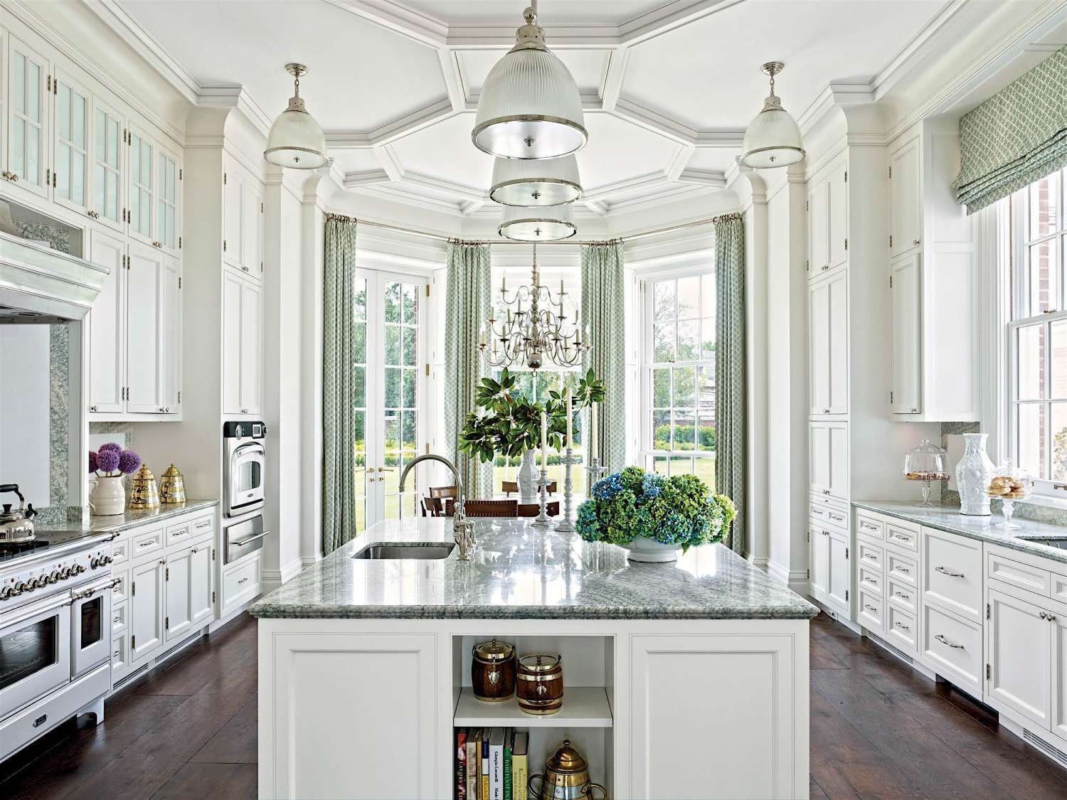 there is a large island in the middle of the kitchen .
