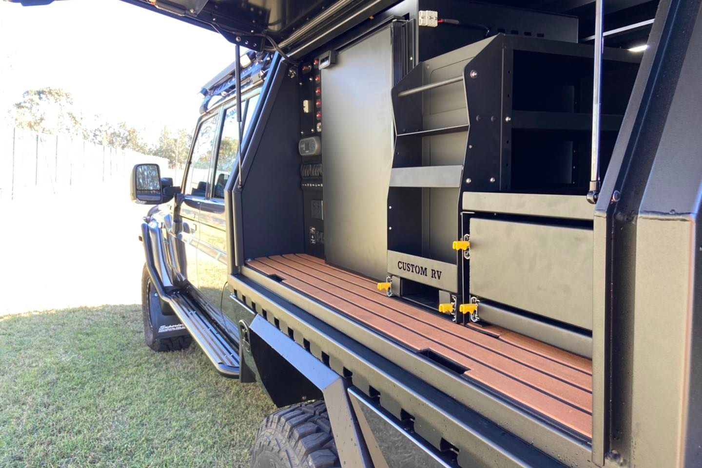 A Vehicle With a Surfboard on Top of It — Custom RV Creations in Ipswich, QLD