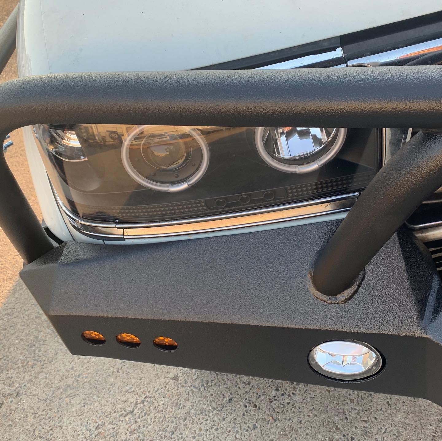 Black Aftermarket Bumper on a White Truck, With Headlights and Amber Lights — Custom RV Creations in Sumner, QLD