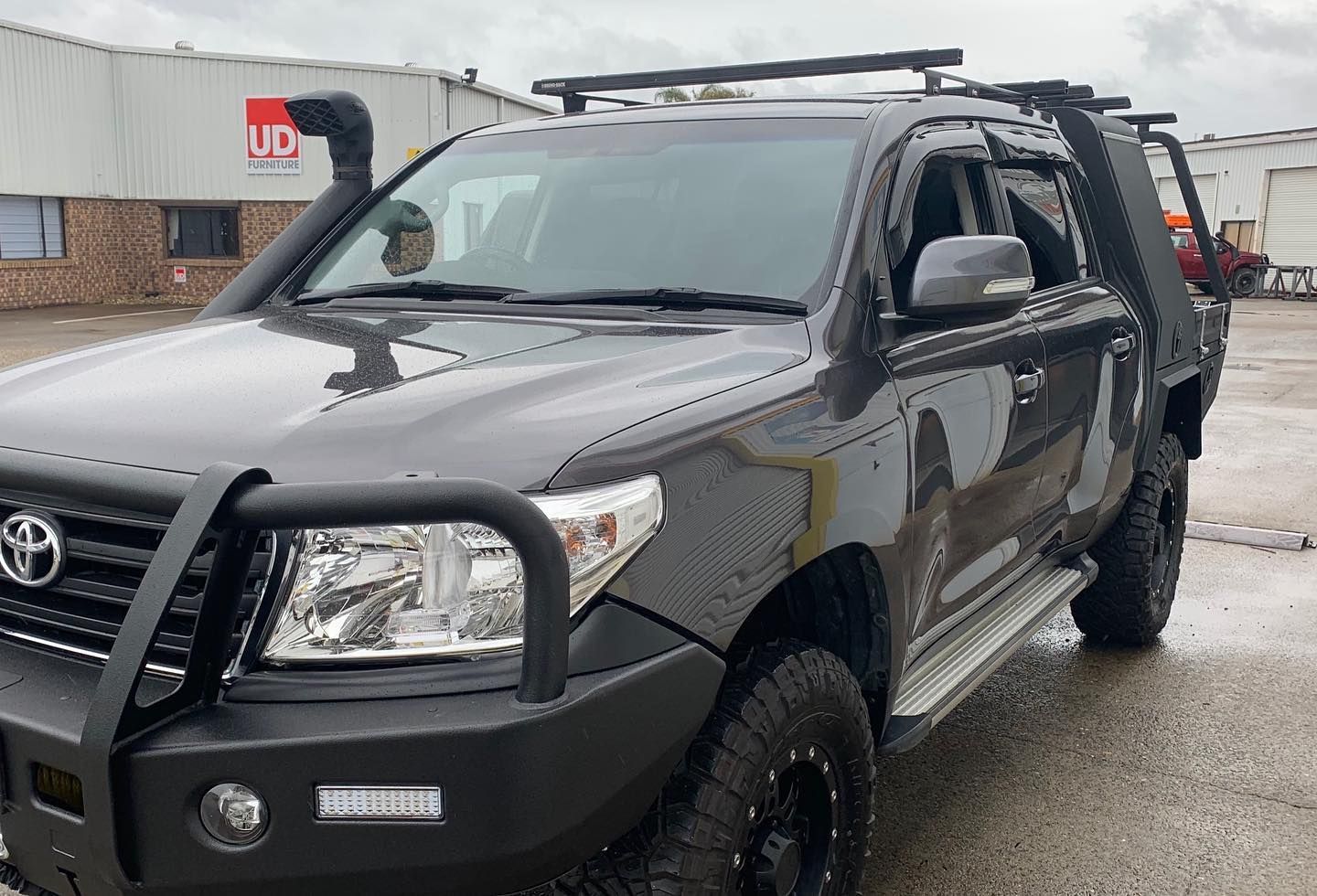 Dark Gray Toyota Land Cruiser With Off-road Modifications — Custom RV Creations in Ipswich, QLD