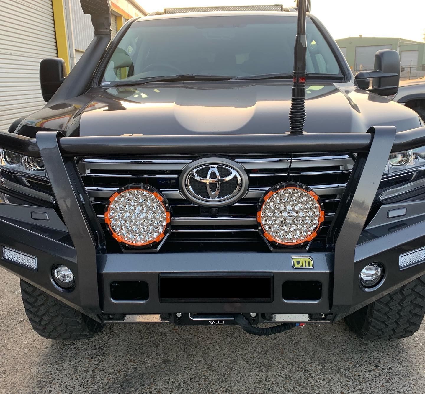 Black Toyota Land Cruiser With a Custom Front Bumper, Spotlights, and Antenna — Custom RV Creations in Sumner, QLD