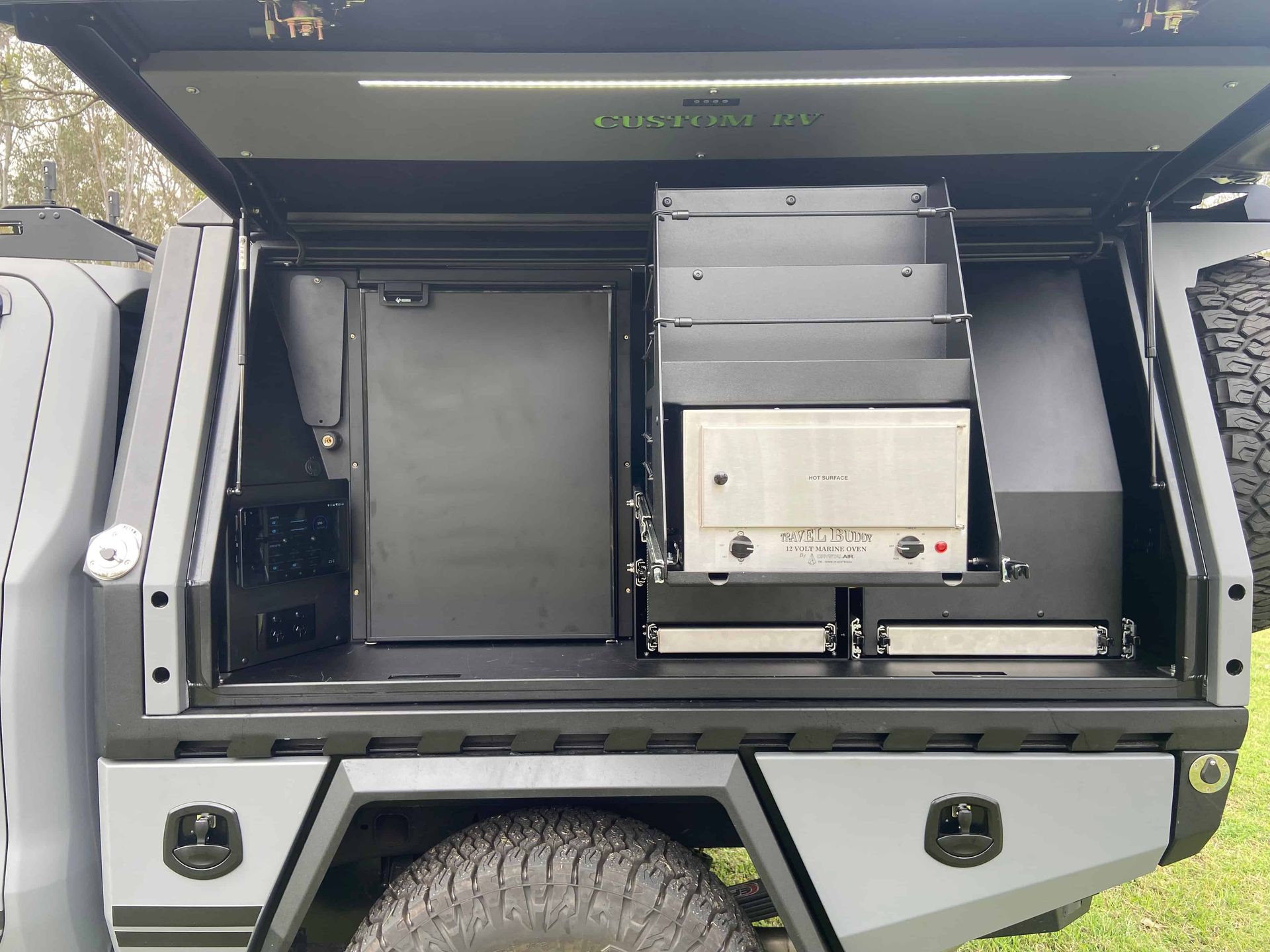 Grey Truck Bed With Built-in Storage Compartments, Shelves, and Equipment, With an Open Top — Custom RV Creations in Sumner, QLD