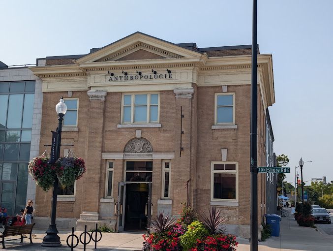 A large brick building with flowers in front of it
