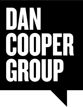 The dan cooper group logo is white on a black background.