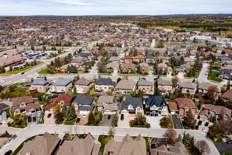 An aerial view of a residential area with lots of houses and trees.