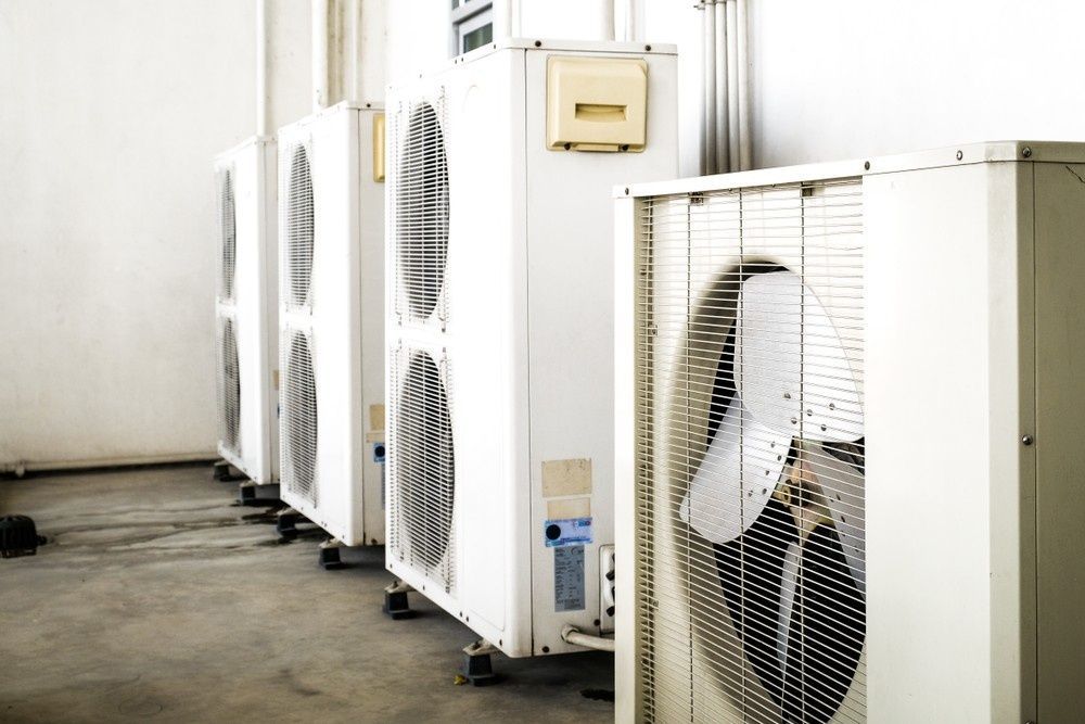 White Air Conditioning Units Aligned in A Row — Gordon's Air Conditioning & Refrigeration Services in Kilcoy, QLD