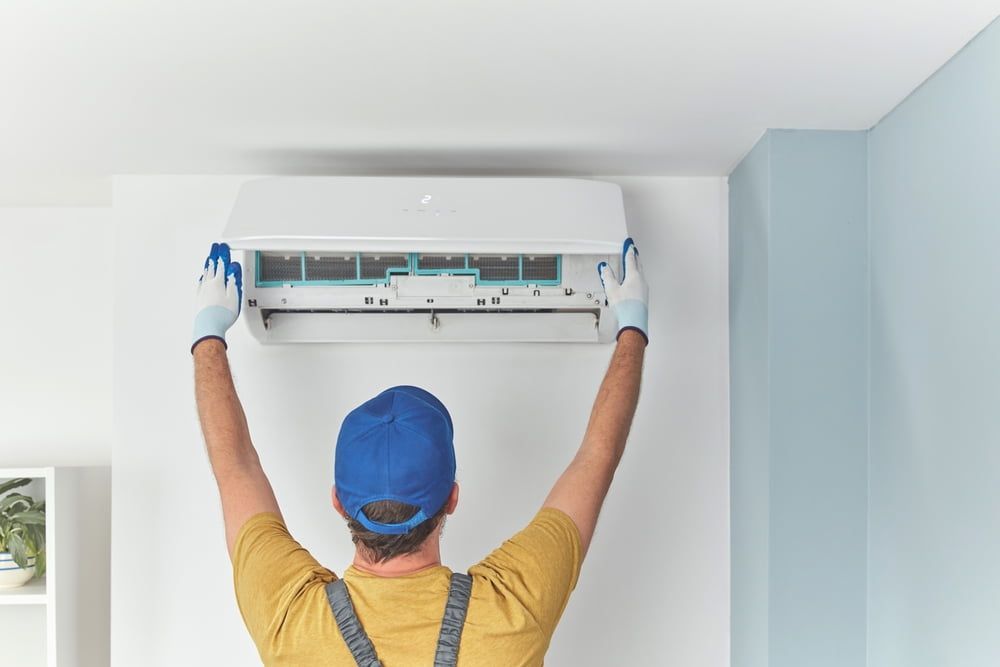 Installing A Split Type Air Conditioner — Gordon's Air Conditioning & Refrigeration Services in Caloundra, QLD