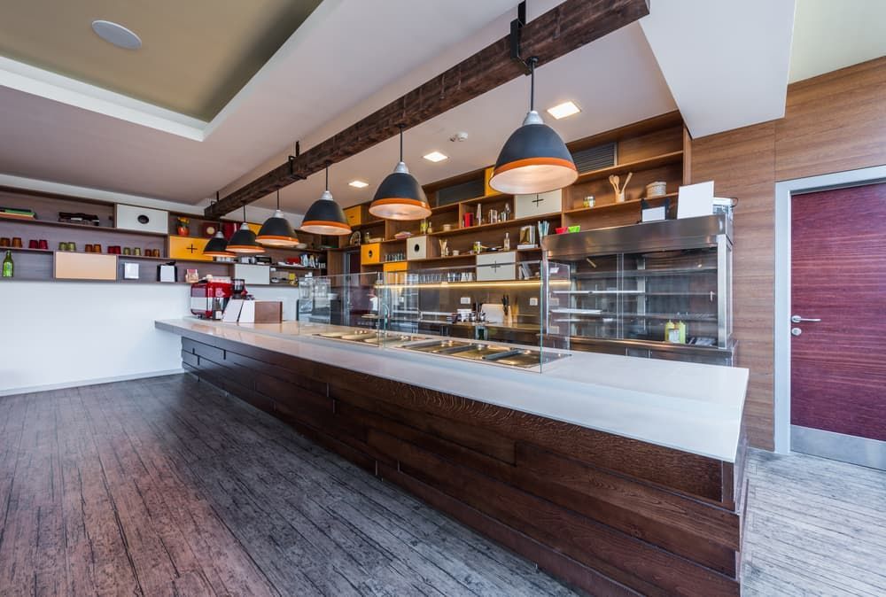 A Restaurant with A Long Counter and A Display Case — Gordon's Air Conditioning & Refrigeration Services in Caloundra, QLD
