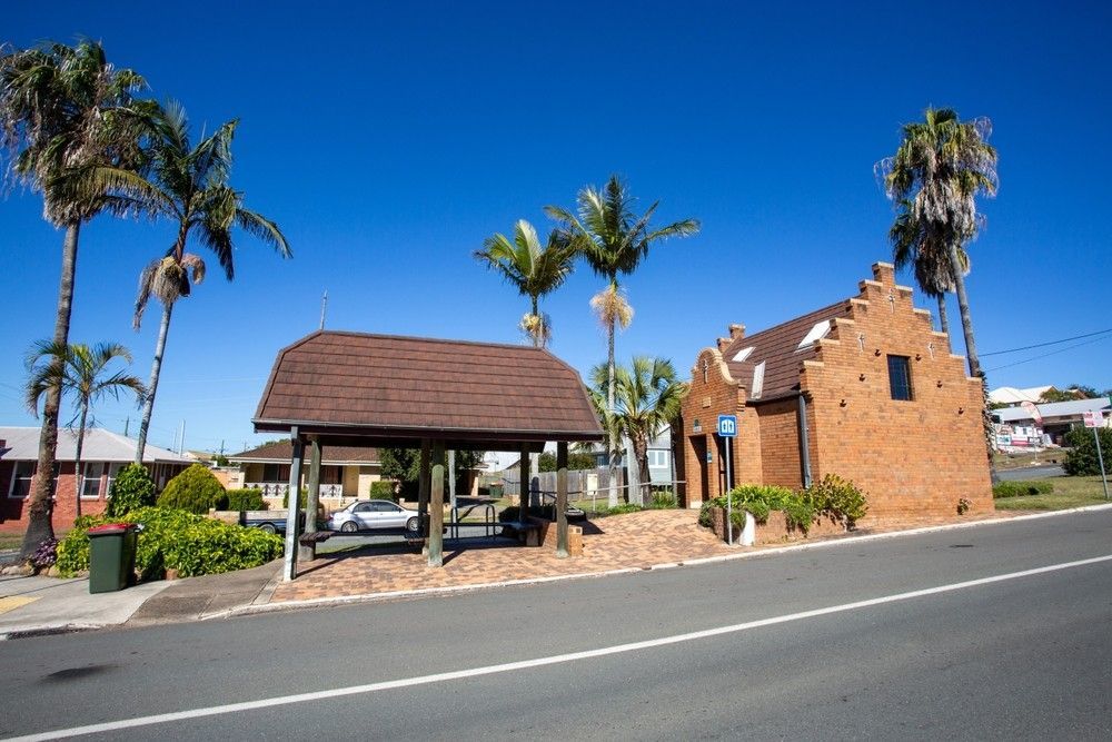 Brick Building with Dutch Gables Next to A Shelter — Gordon's Air Conditioning & Refrigeration Services in Kilcoy, QLD
