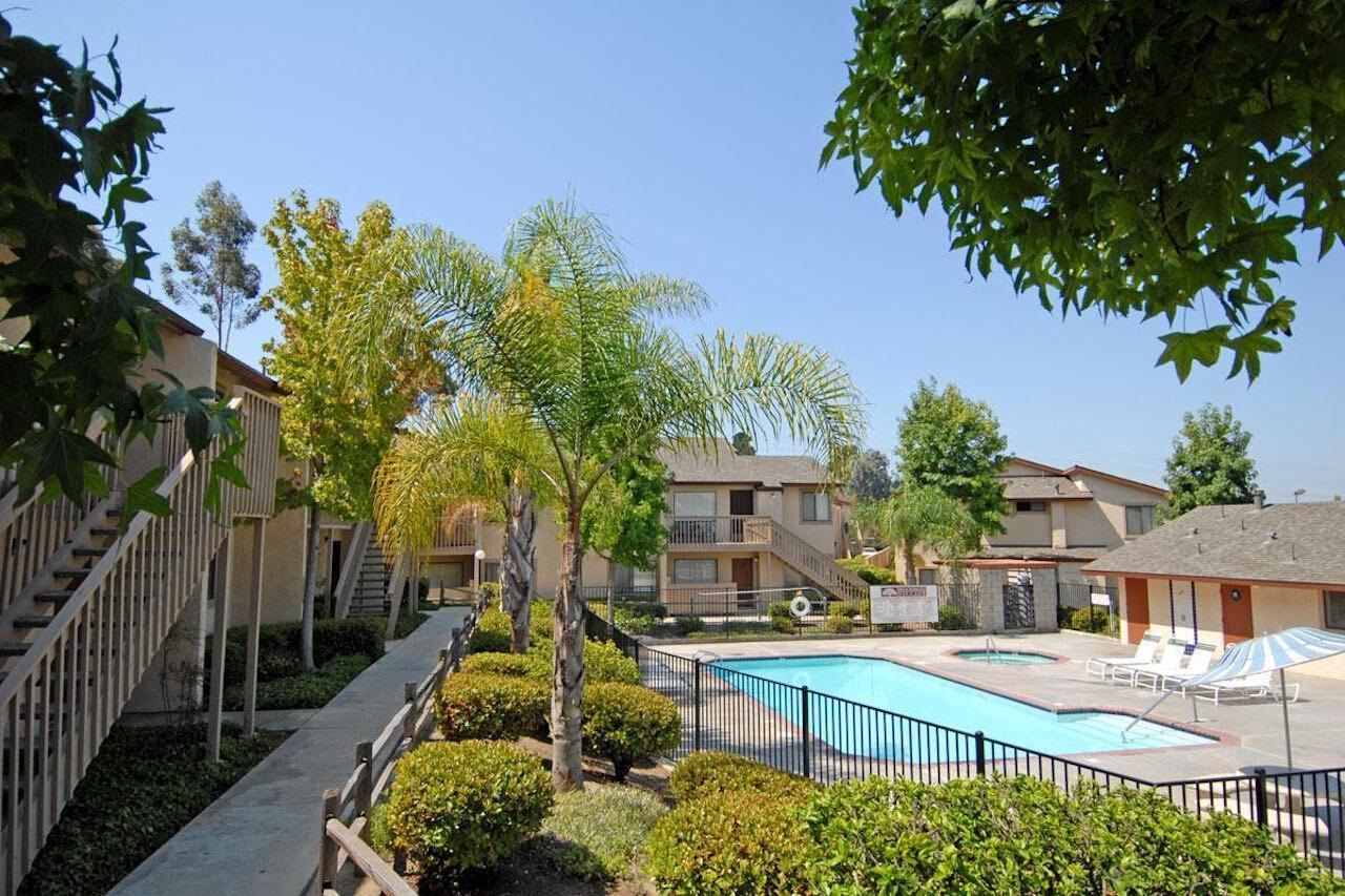 Go to woodmanvillageapts.com