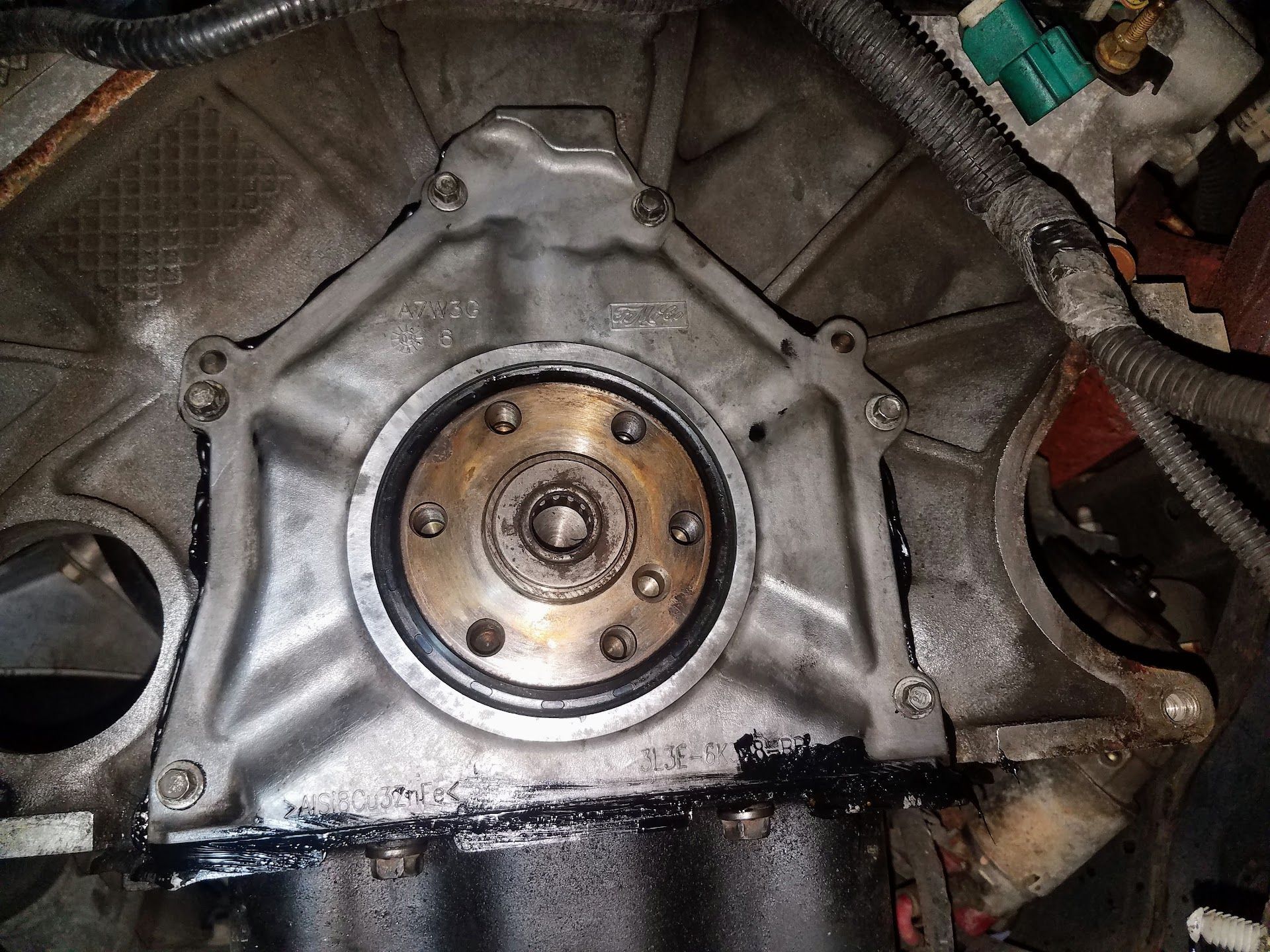 Engine block with a metal plate | St. Lucie Auto Dynamics