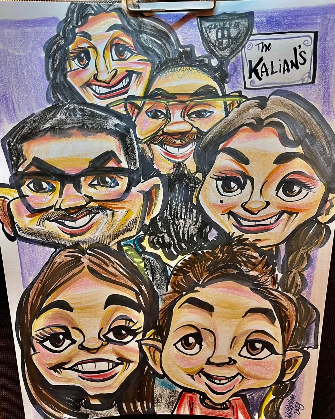 Colorful caricature drawing of five smiling faces with a small “Kalian’s” sign in the top right.