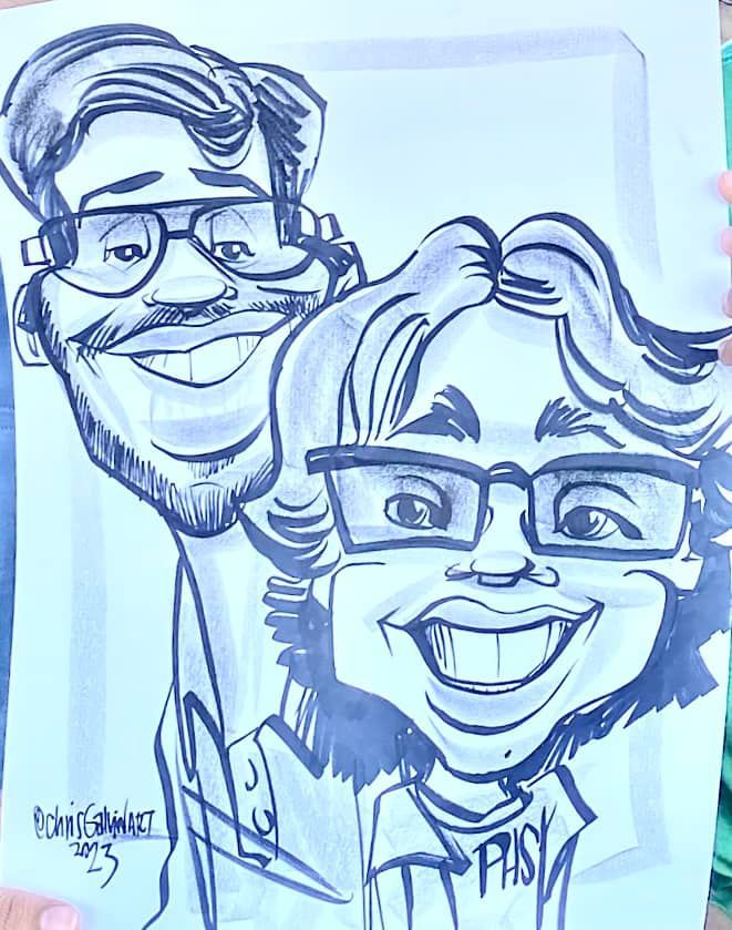 Blue pen caricature of two smiling, glasses-wearing people in a framed sketch