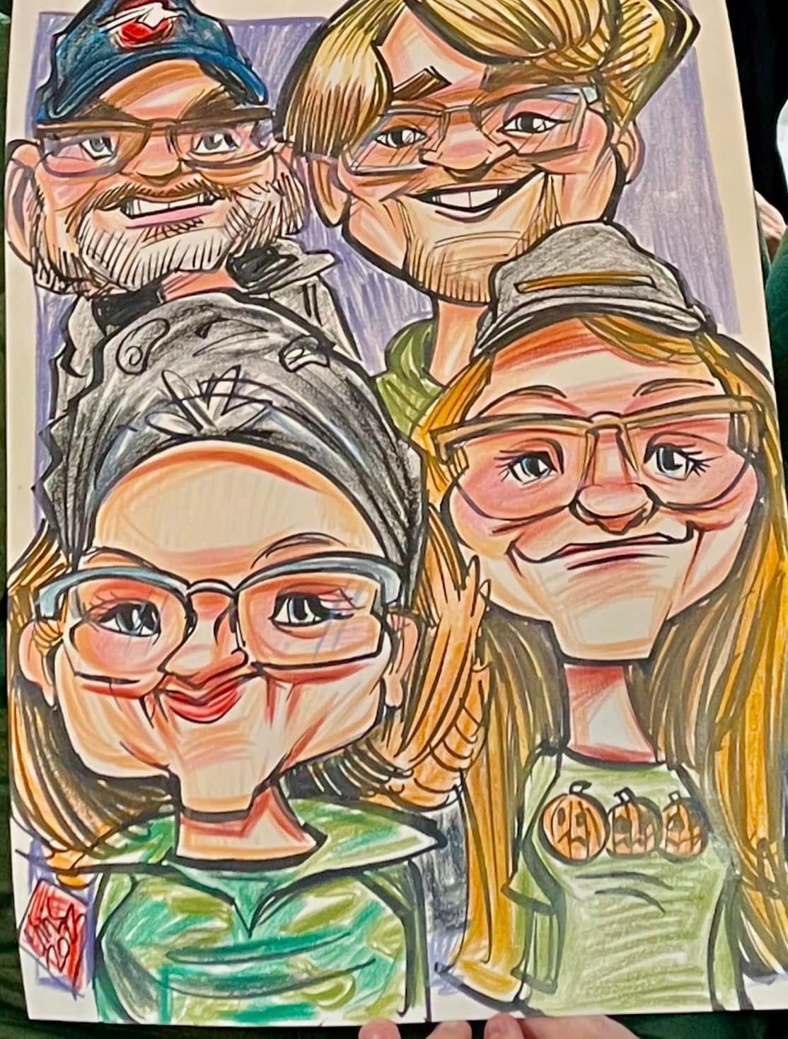Four smiling cartoon-style portraits, colorful hand-drawn family faces on paper.
