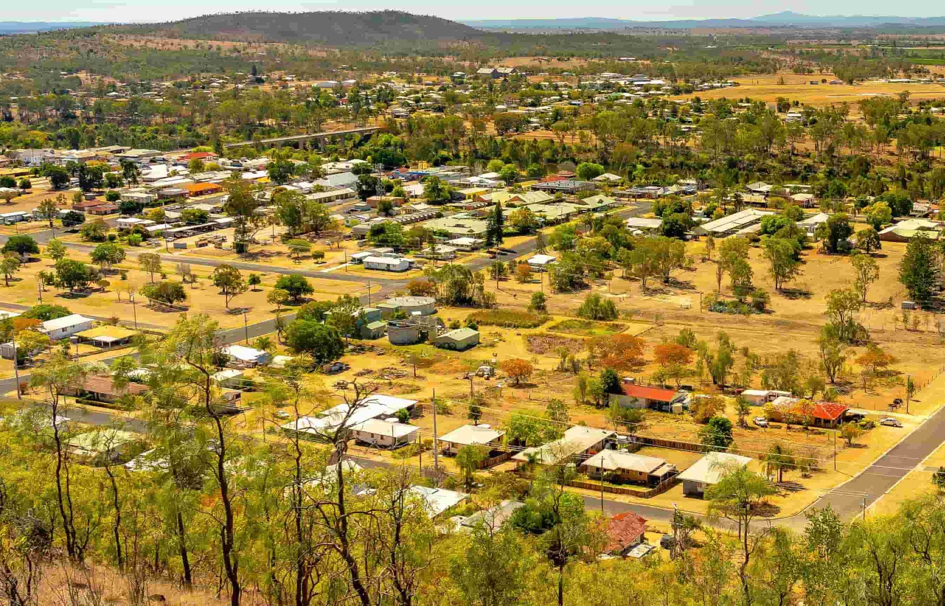 An Aerial View of a Small Town Surrounded by Trees and Bushes — Active Tree Fellas in Childers, QLD