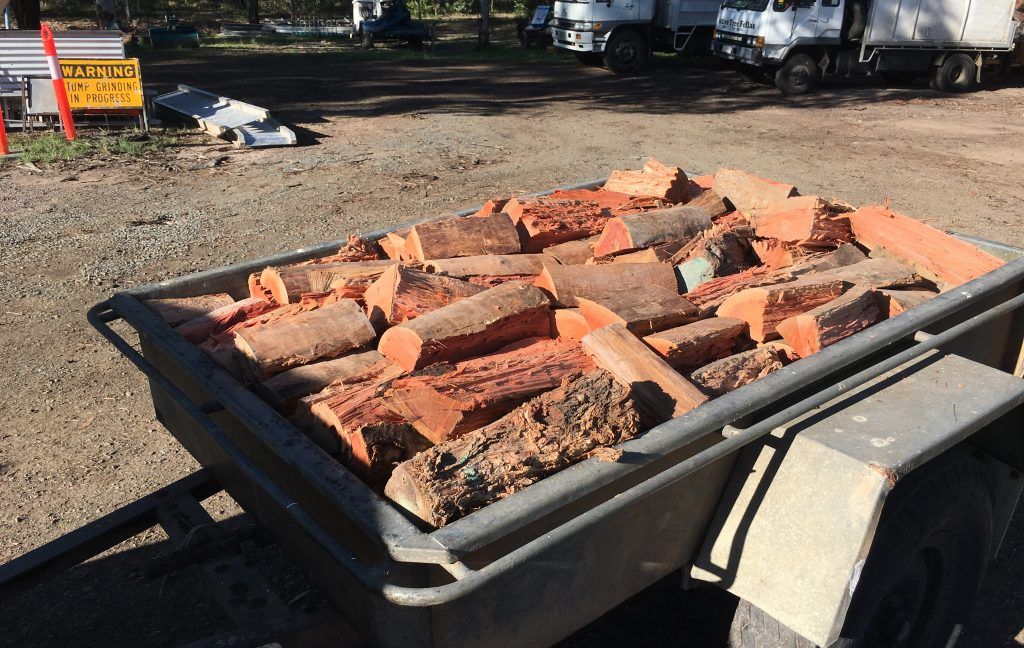 Orange Coloured Firewood — Active Tree Fellas in River Heads, QLD