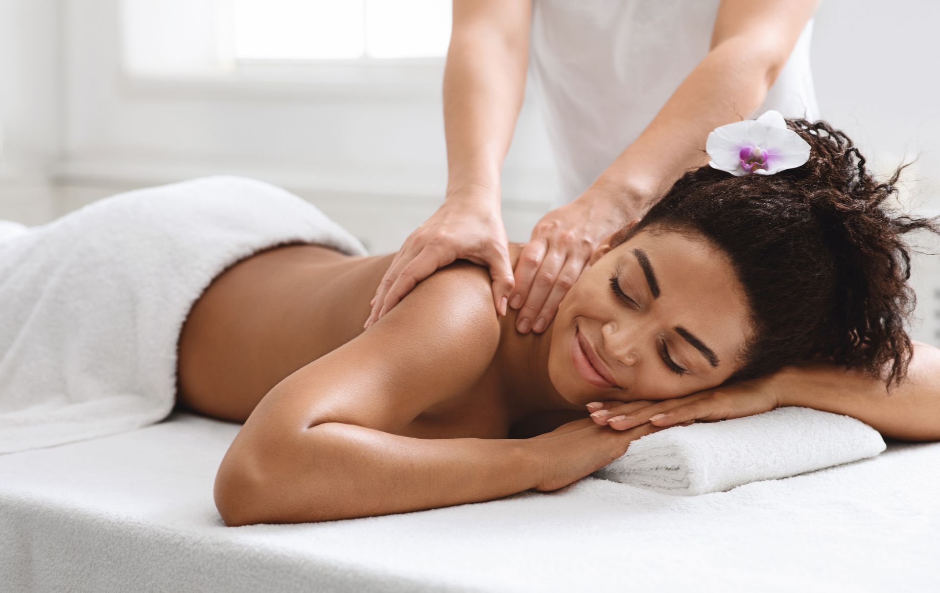 A woman is getting a massage at a spa.
