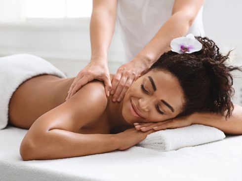 A woman is getting a massage at a spa.