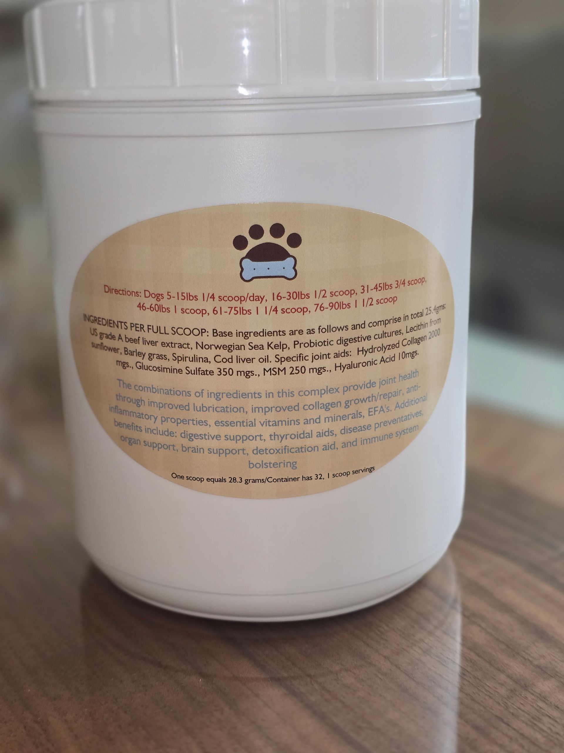 White plastic jar with a beige label on a wooden surface.