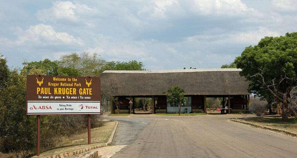 A sign that says paul krueger gate on it
