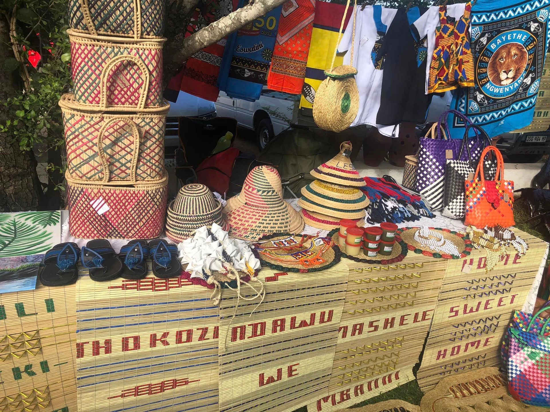 a table with a bunch of items on it and a sign that says thokozi adawu