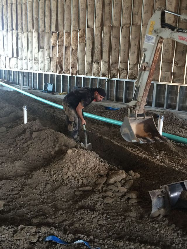 New construction plumbing rough-in inside a framed home.