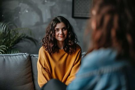 Teenager having conversation with psychologist psychiatrist psychological treatment talking advice problem solving child consultation young person therapy anxiety depression care health assistance