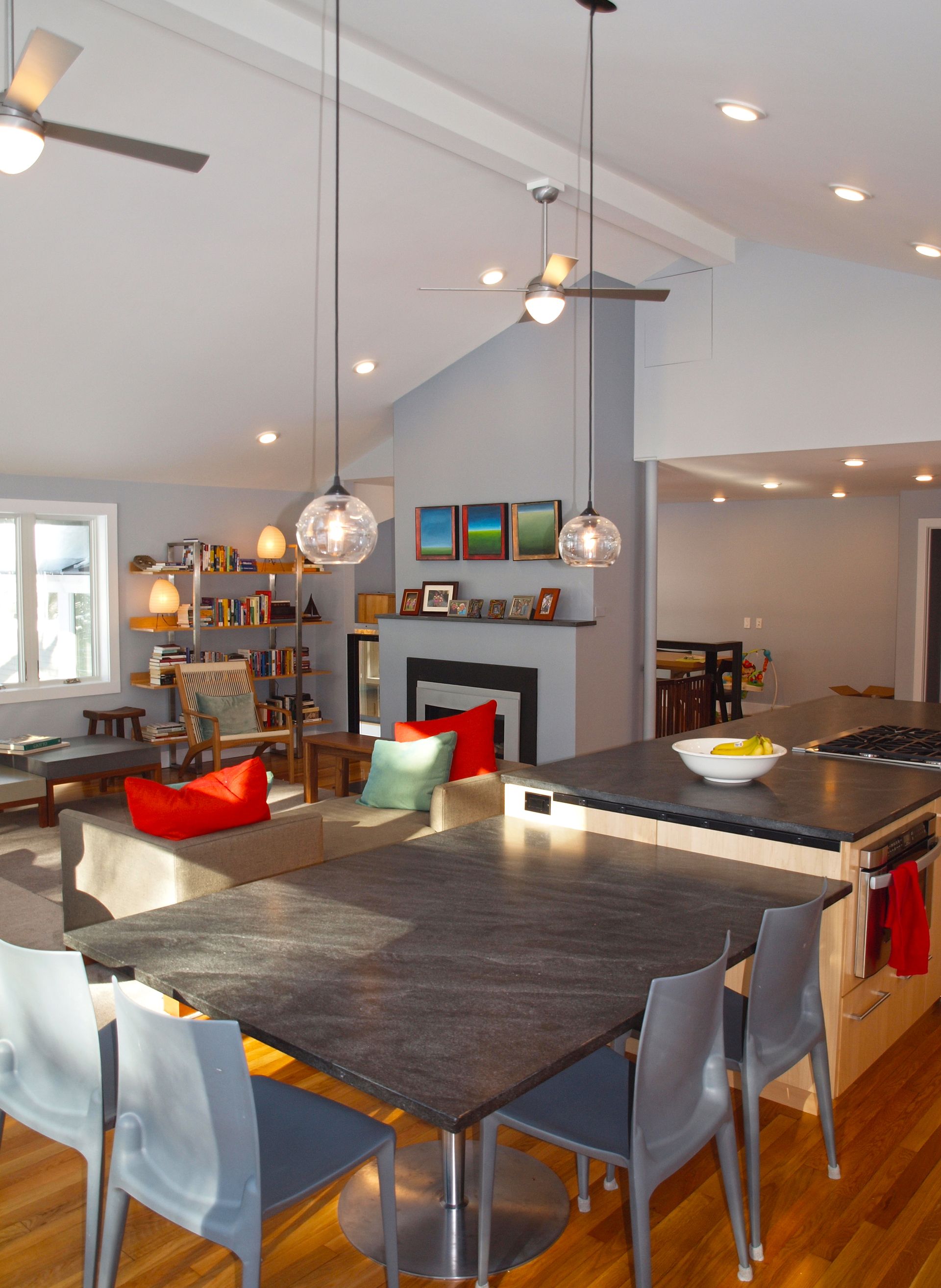A kitchen with a table and chairs and a fireplace