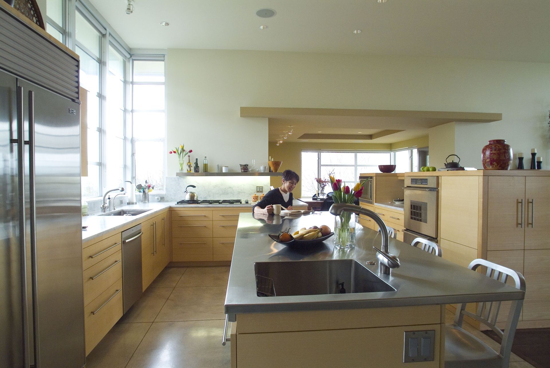 A kitchen with stainless steel appliances and wooden cabinets