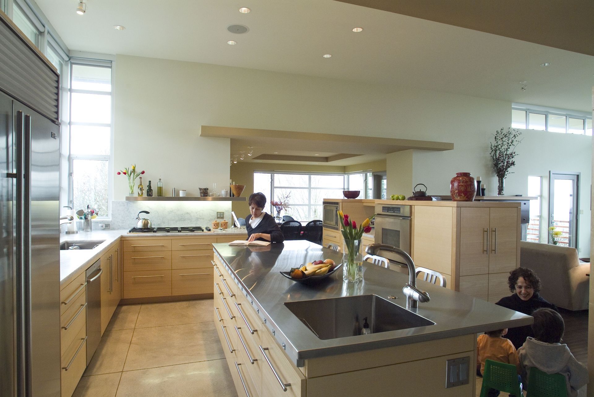 A kitchen with stainless steel appliances and wooden cabinets