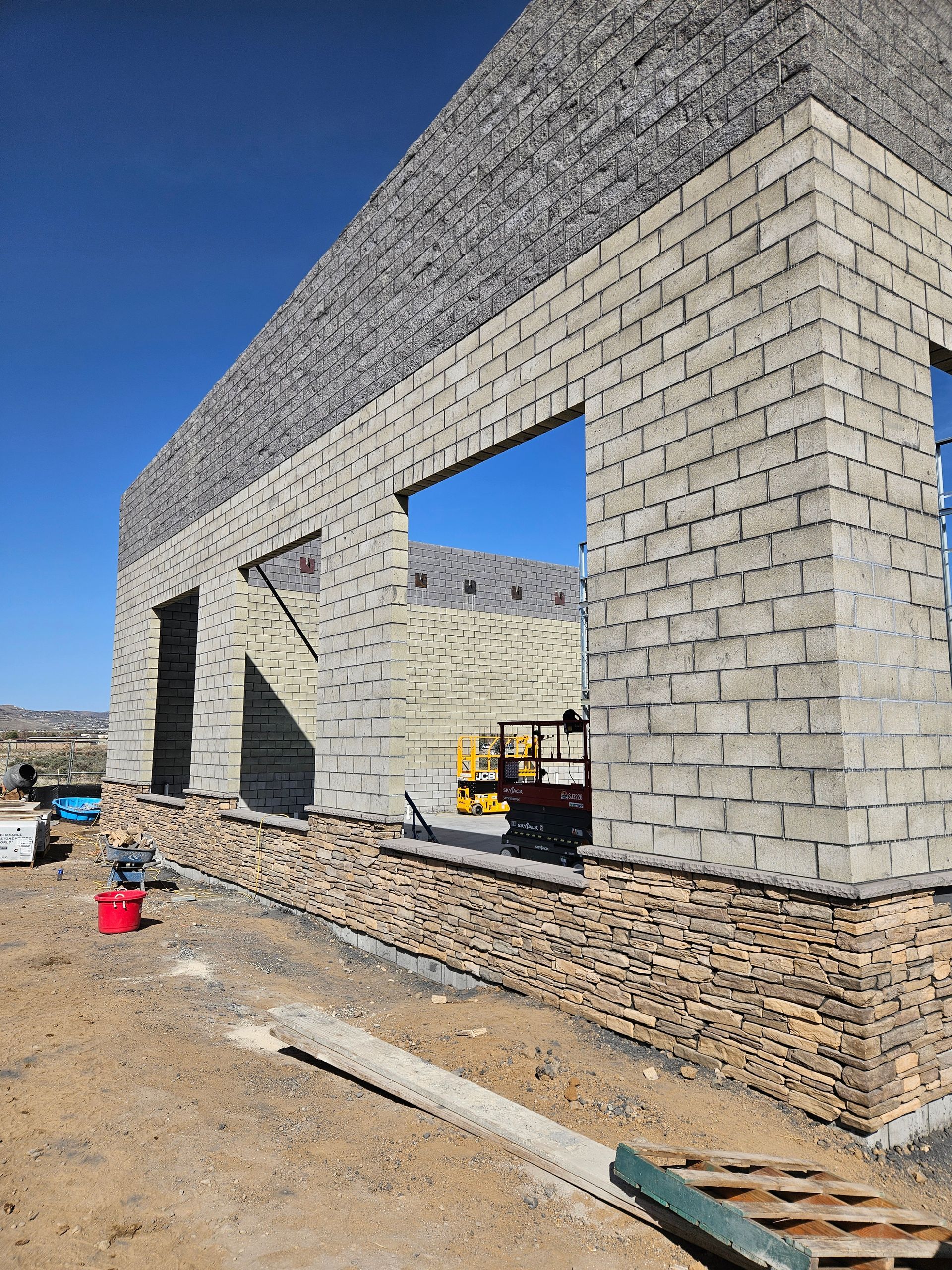A building is being built with bricks and stone