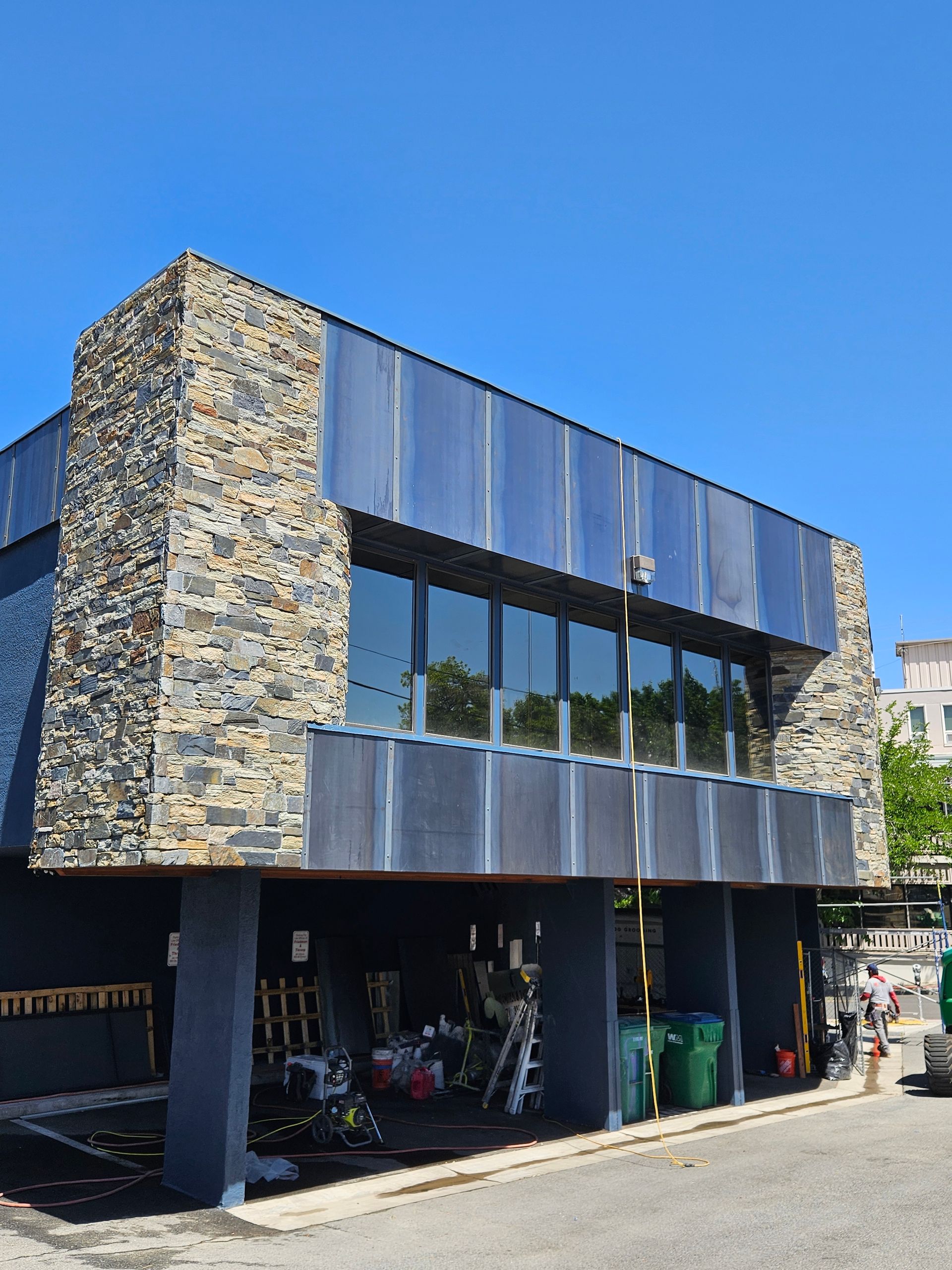 A large building with a lot of windows and a stone facade