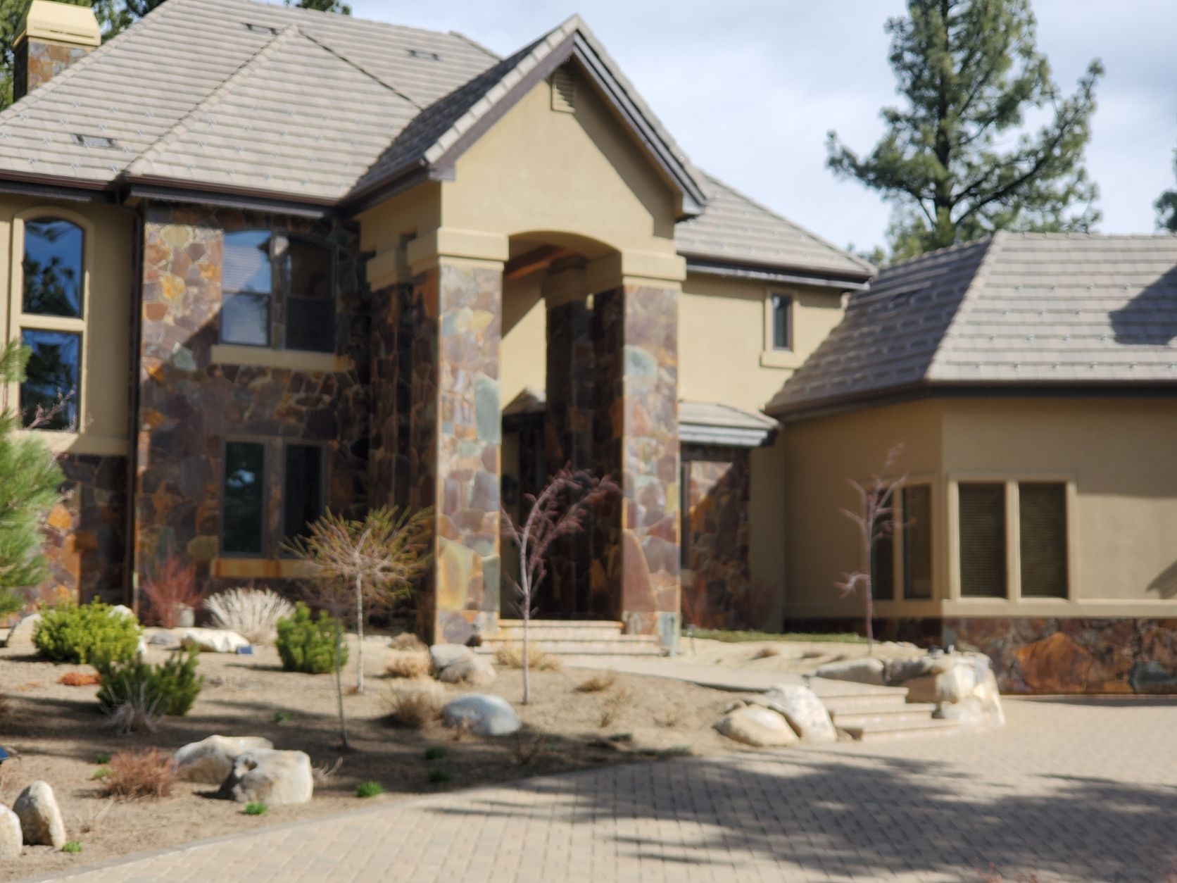 A large house with a stone facade