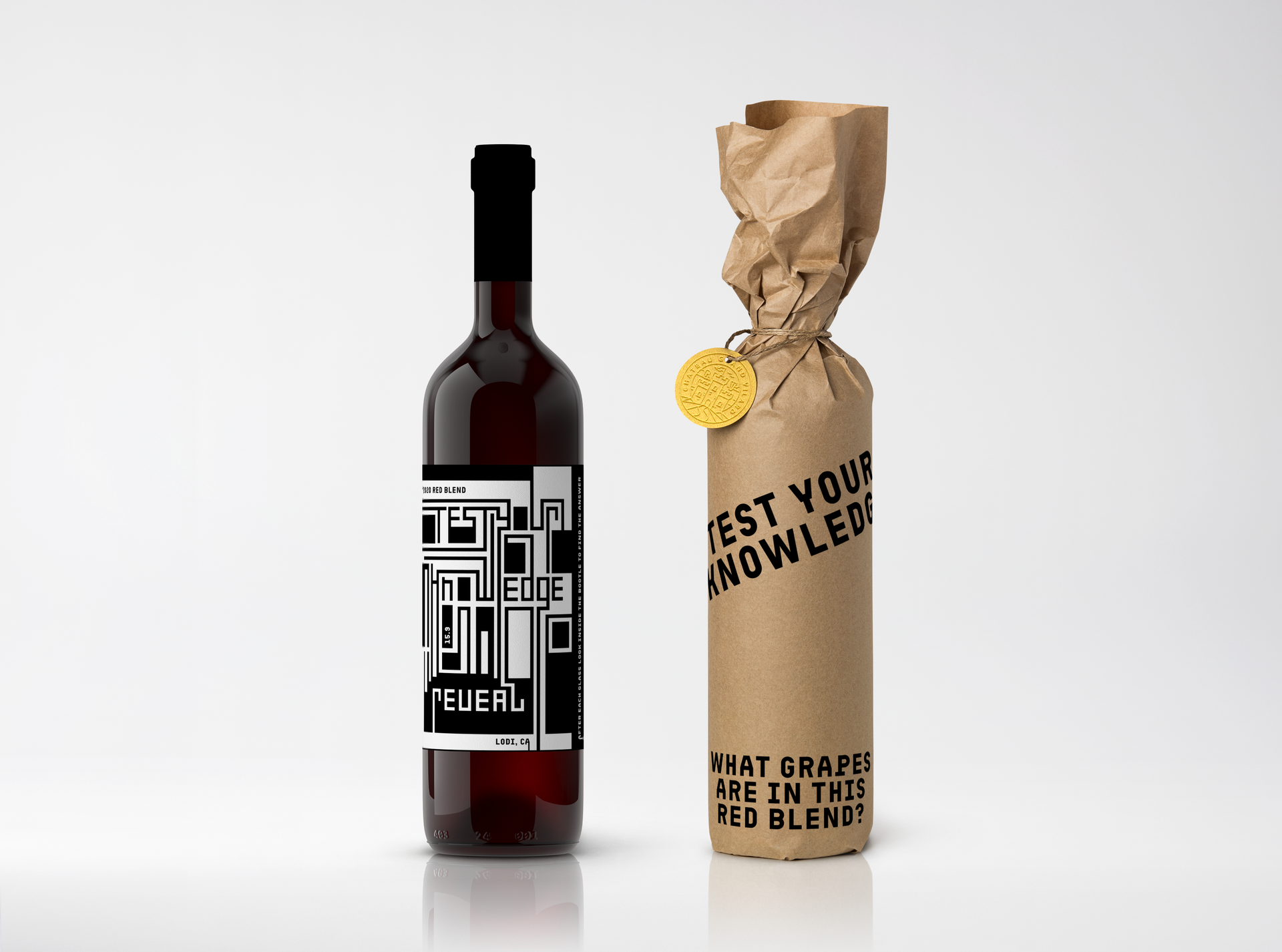 Bottle of red wine next to a wrapped bottle in brown paper.