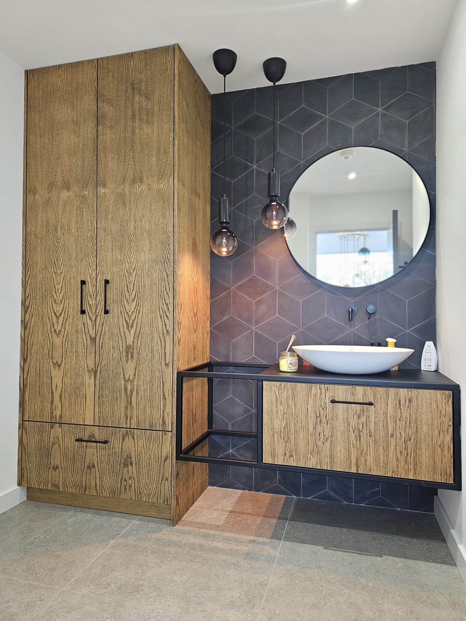 A bathroom with a sink and a mirror on the wall