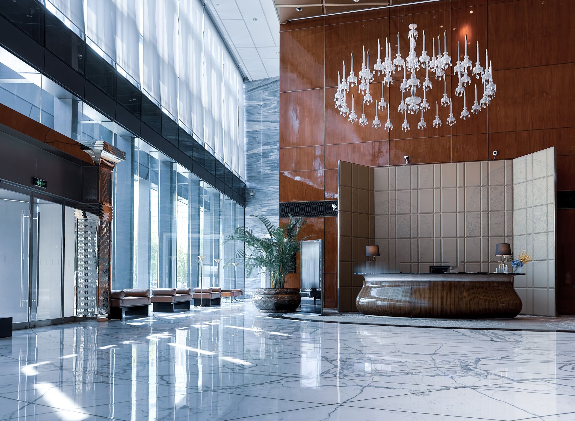 A large lobby with a chandelier hanging from the ceiling.
