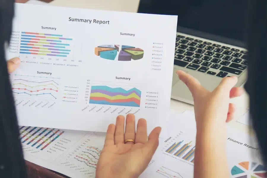 Florida Coast SEO team member showing a client a summary report from digital marketing services.