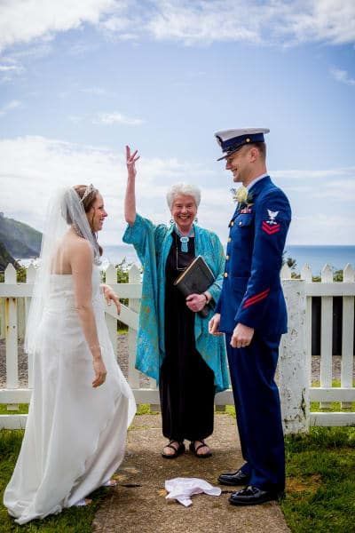 A bride and groom are standing next to each other at their wedding ceremony.