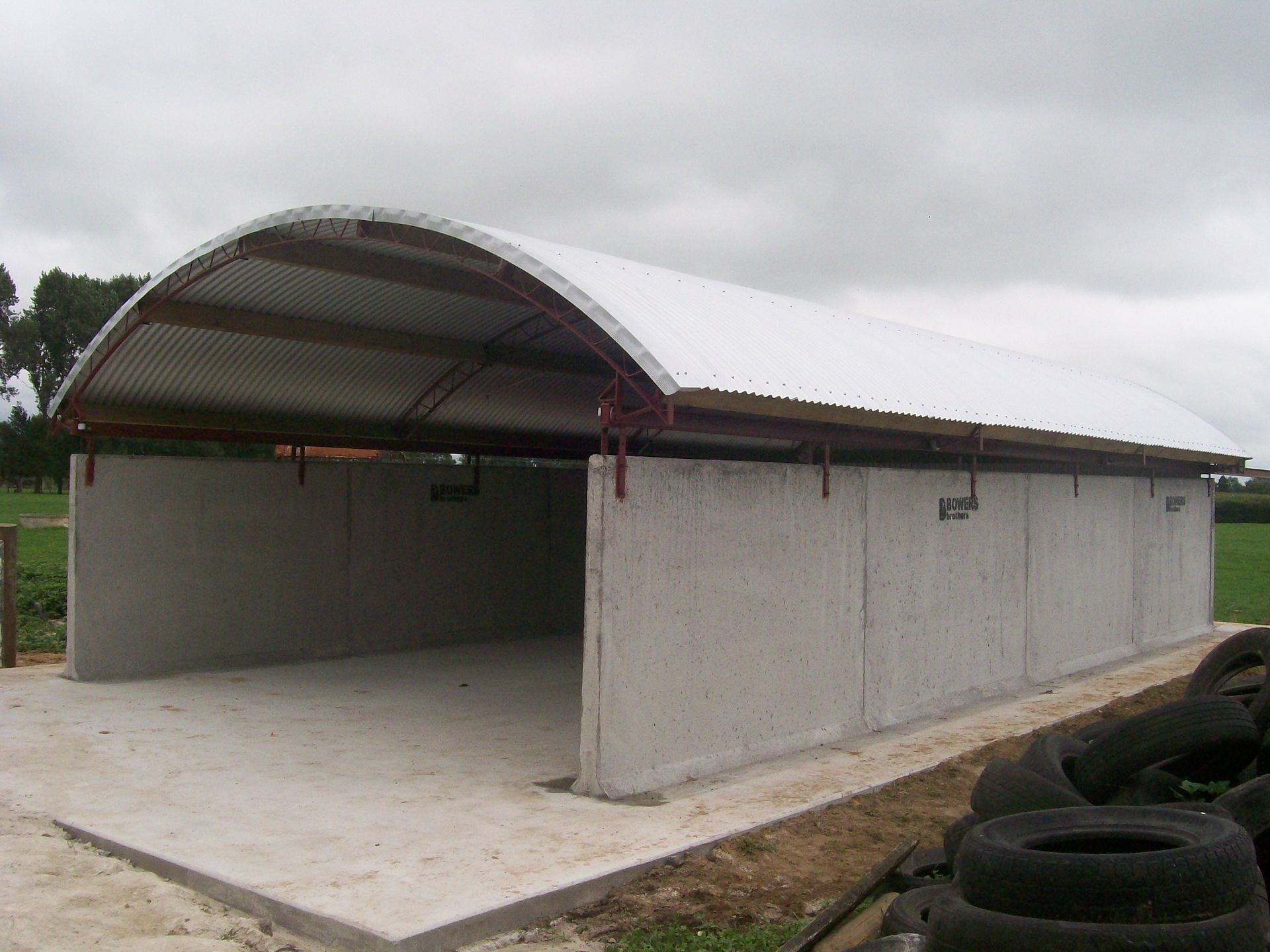 A large empty building with a curved roof