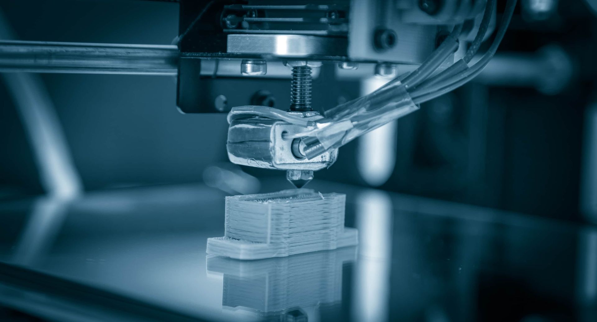 A Close Up of a 3d Printer Printing a Piece of Plastic — Lismore Computer Solutions in Casino, NSW