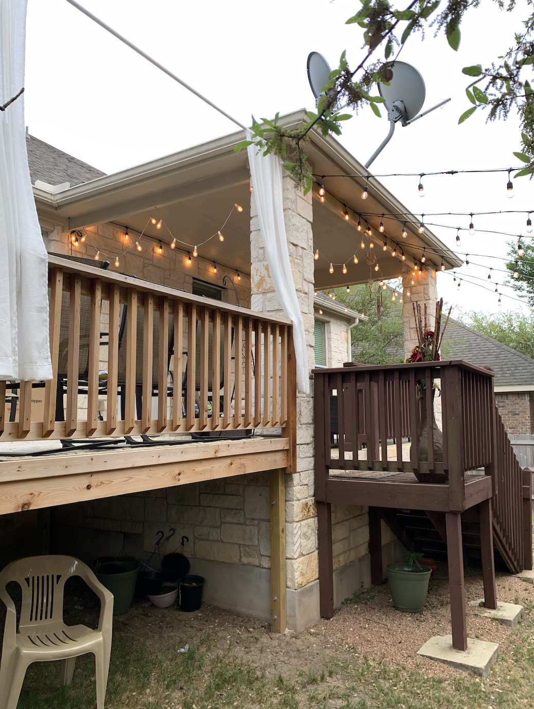 A wooden deck with a satellite dish on top of it.