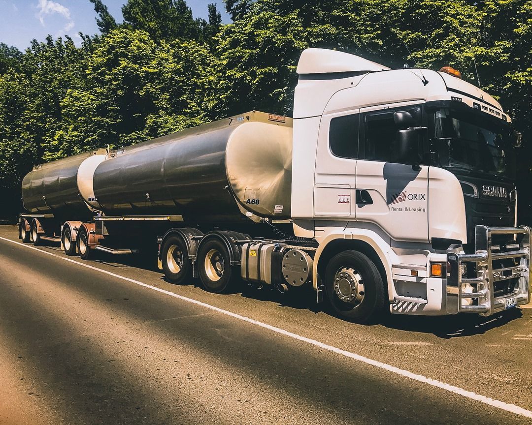 White and Silver Tanker Truck on A Road, Trees in Background — Highlands Water Cartage in Wagga Wagga, NSW
