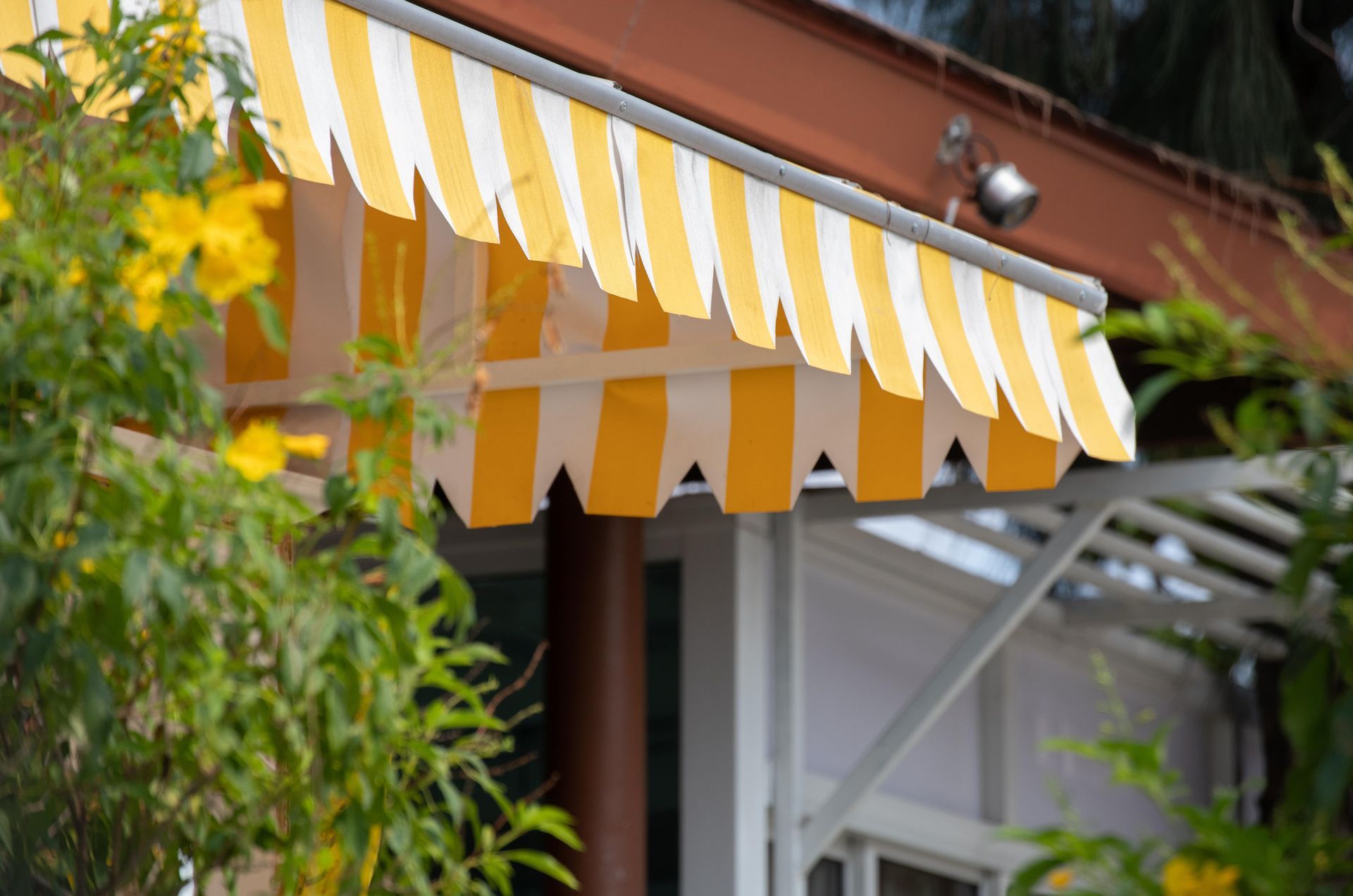 Yellow and White Striped Greenhouse Awning