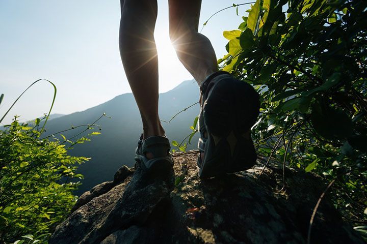 hiking boots stepping on a rock,