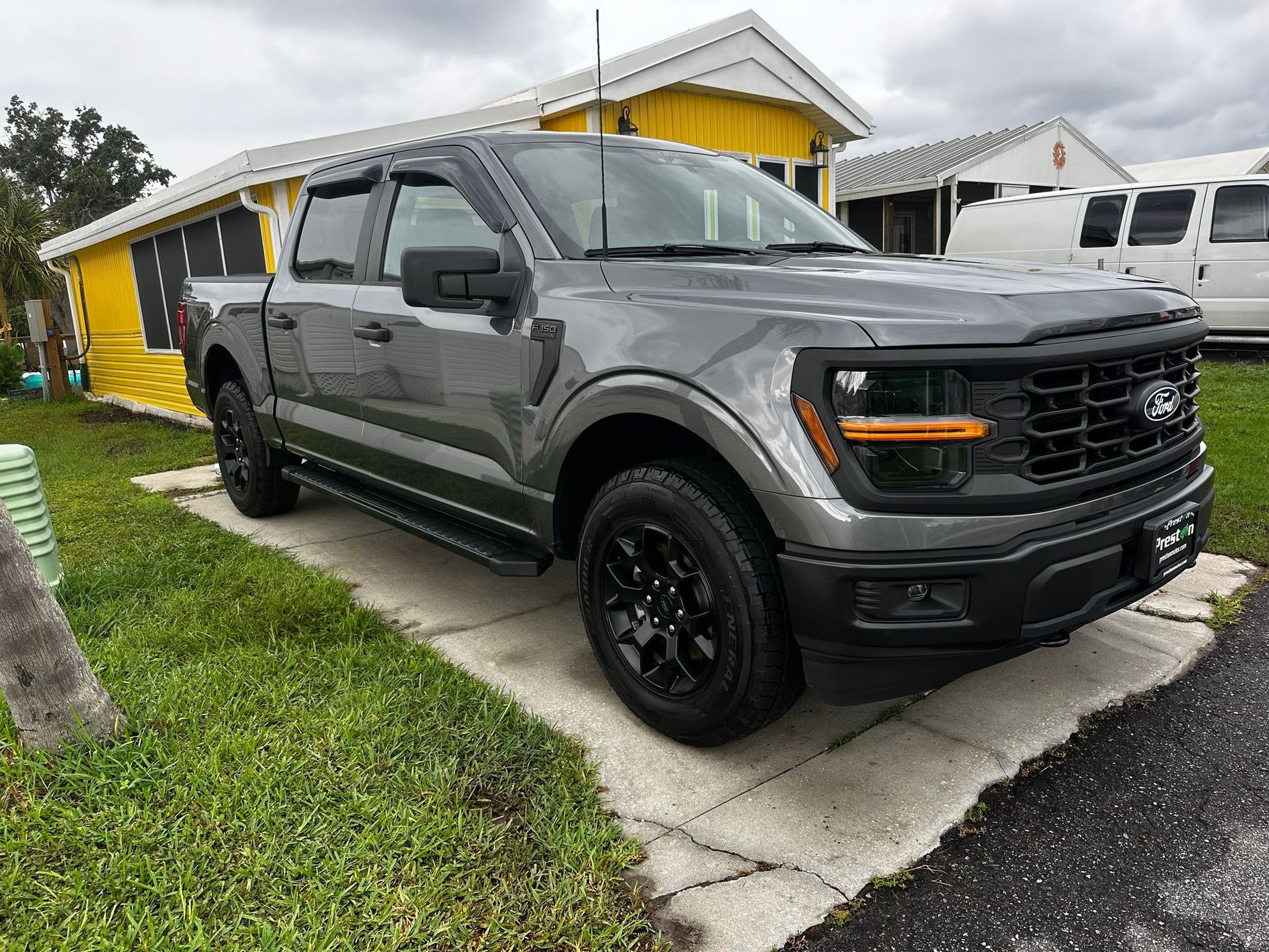 Detailer performing paint correction with dual-action polisher