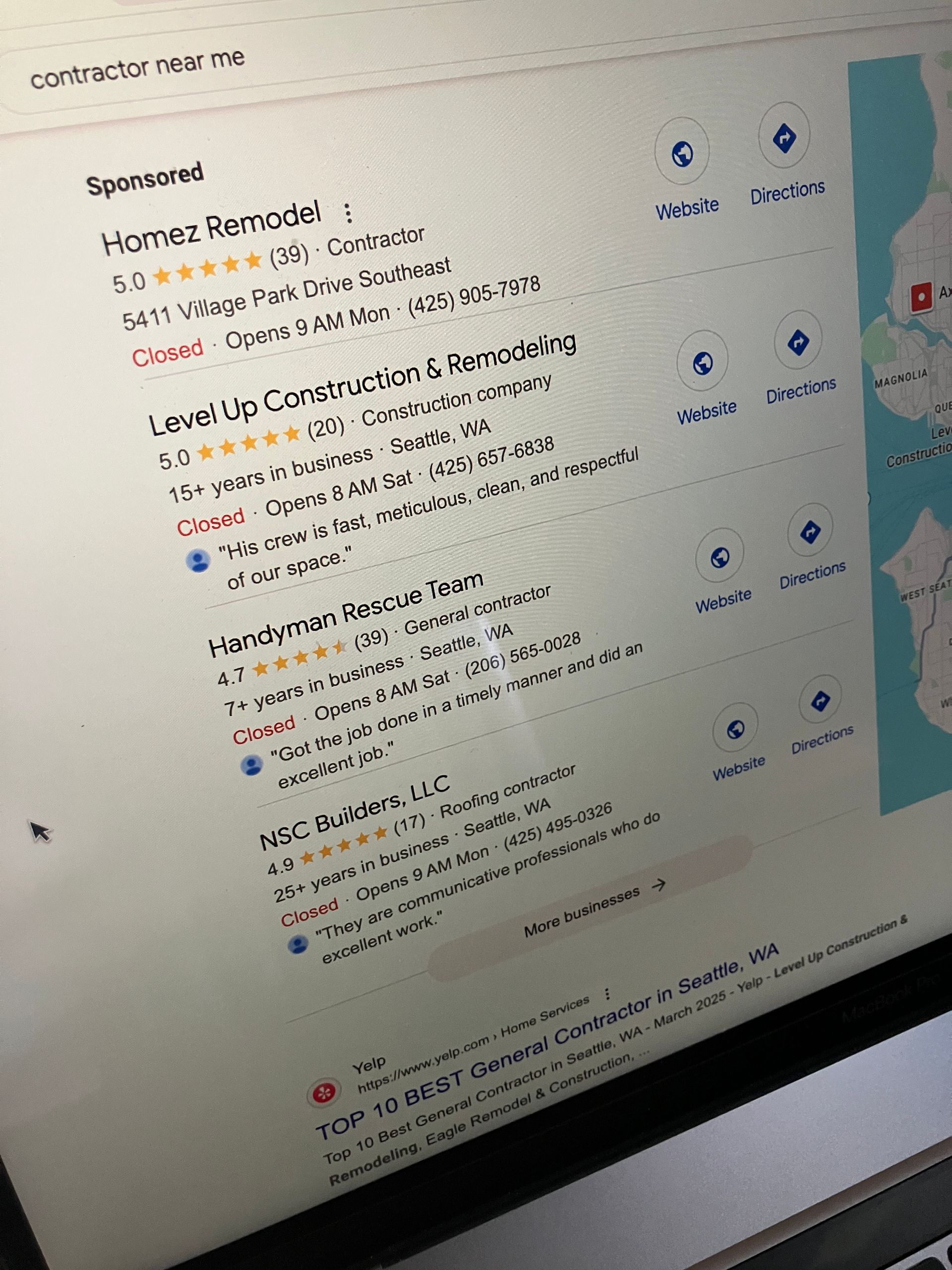 A close up of a laptop screen with a map on it showing Homez on top result in Seattle WA.
