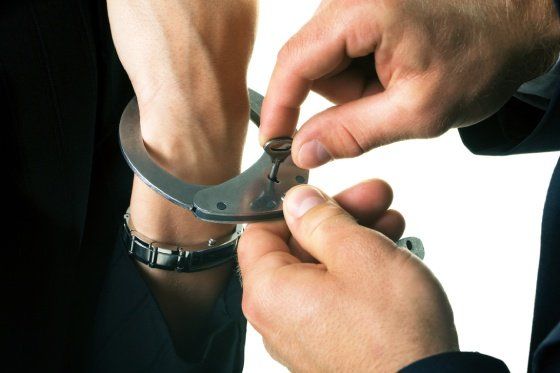 close-up of male hands with pen over document